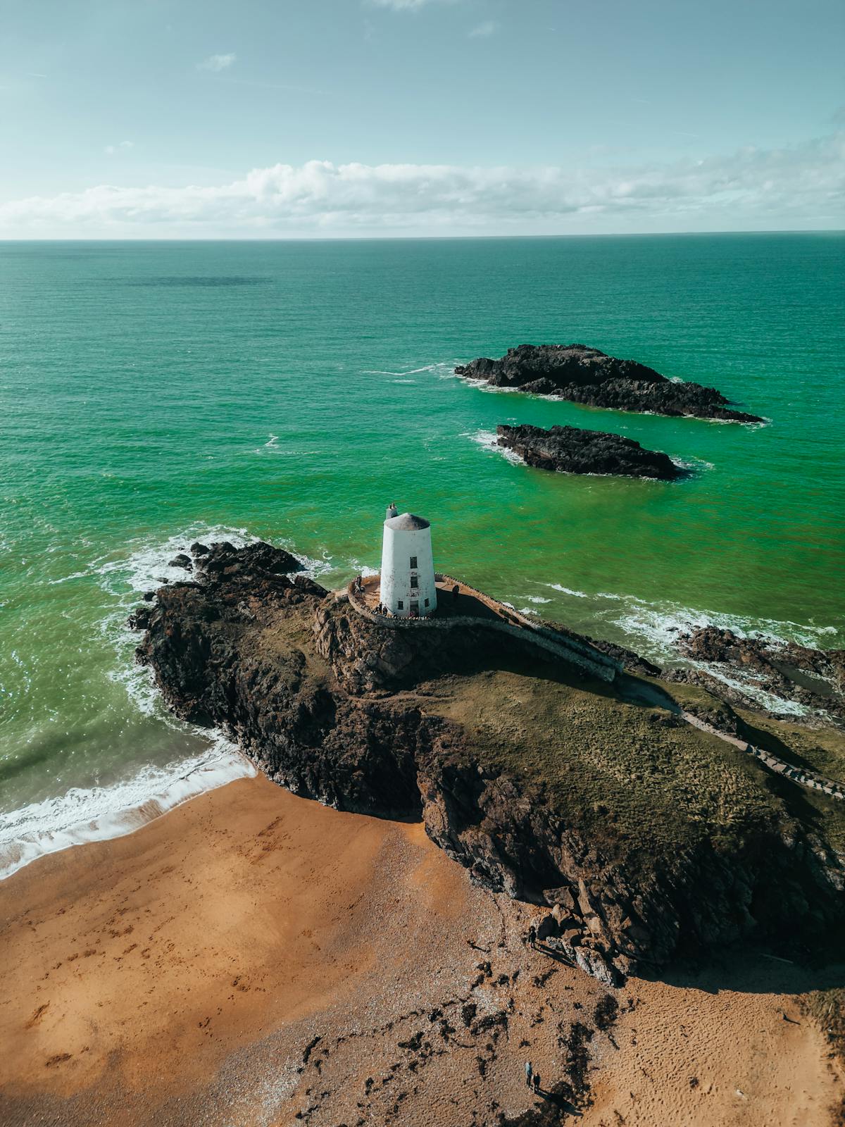 Lighthouse on rocky Welsh coast