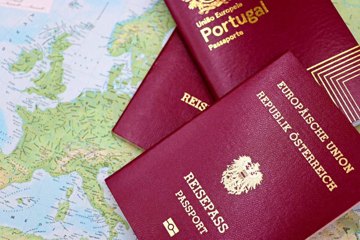Passports placed on world map representing international travel authorization options