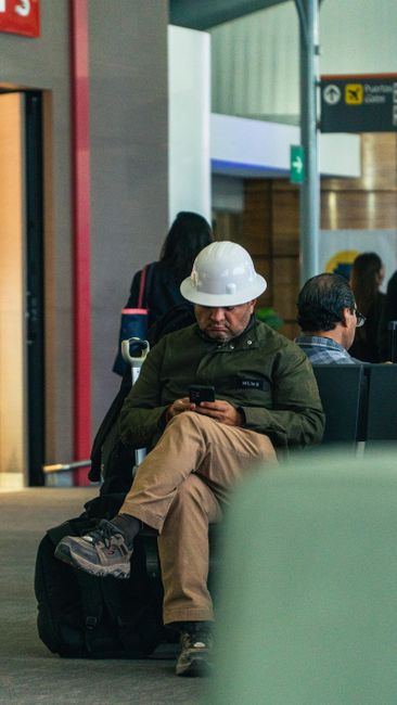 Traveller checking UK ETA exemptions on a phone