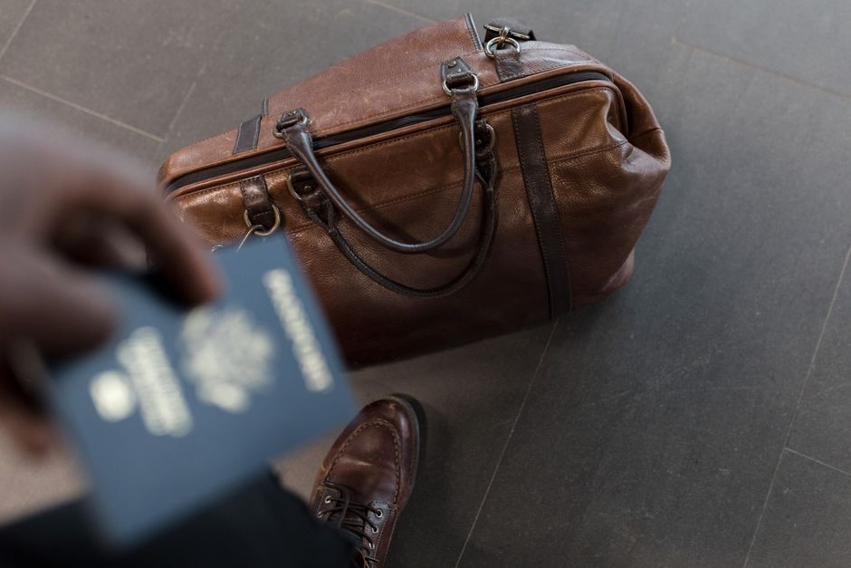 Passport and boarding pass at the airport for a UK concert trip ETA
