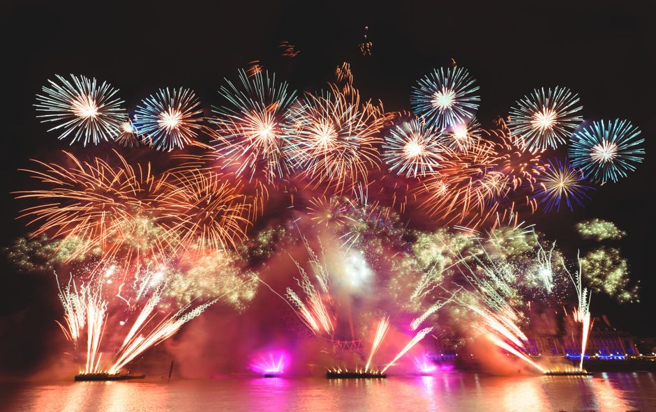 Crowds watching the midnight New Year fireworks along the Thames in London