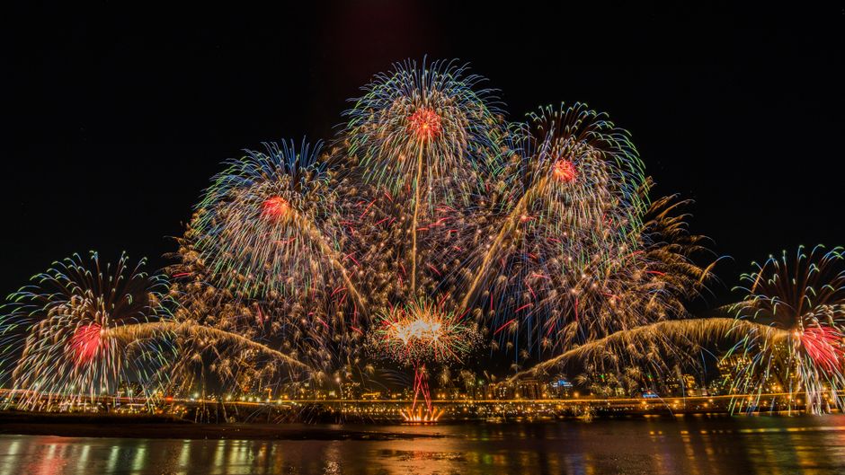 London Eye illuminated during the New Year's Eve fireworks celebration
