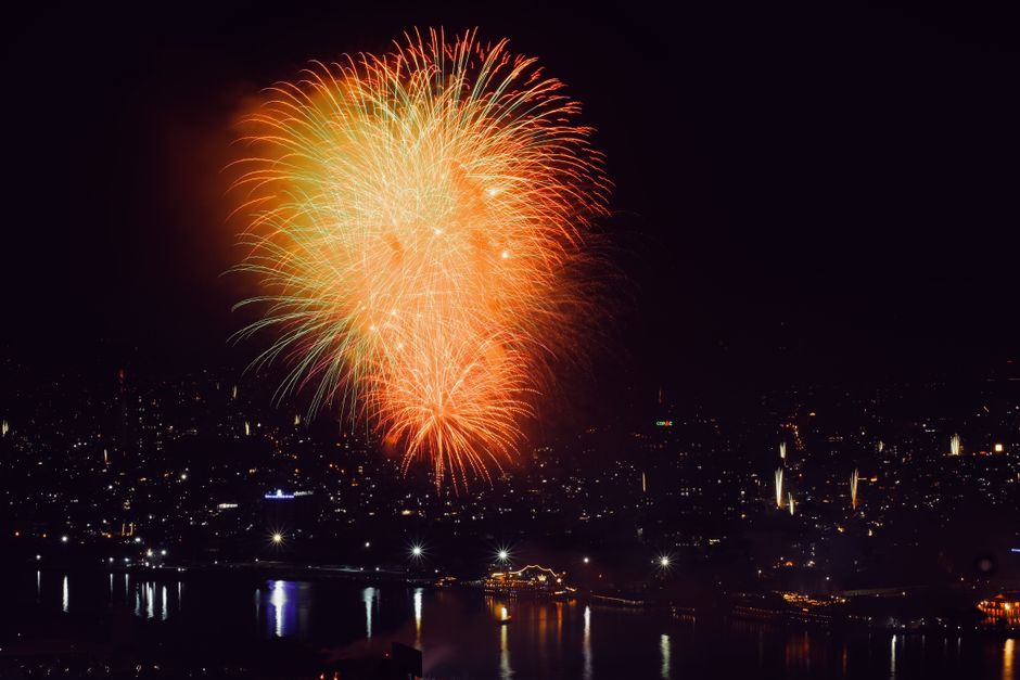 Golden fireworks reflected over the River Thames on a November night in London